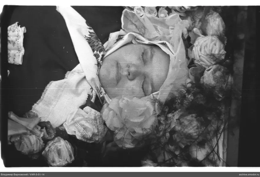 Portrait of a woman with covered face and flowers