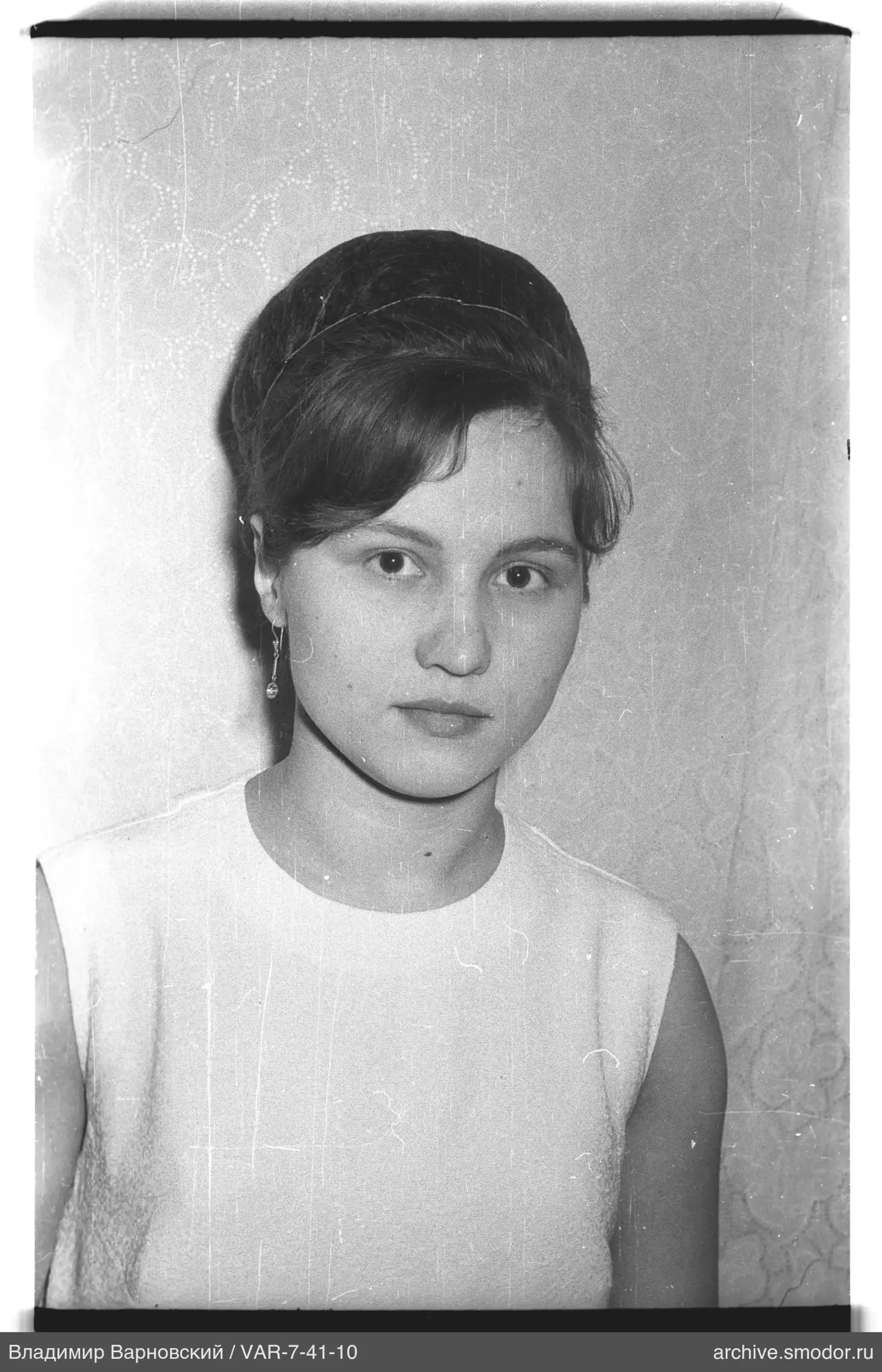 Portrait of a woman in a light top