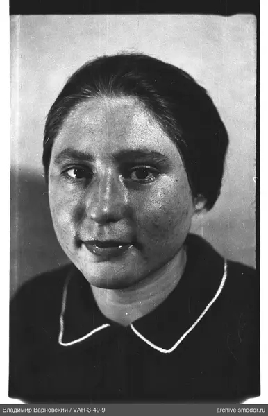 Portrait of a woman in a dark top