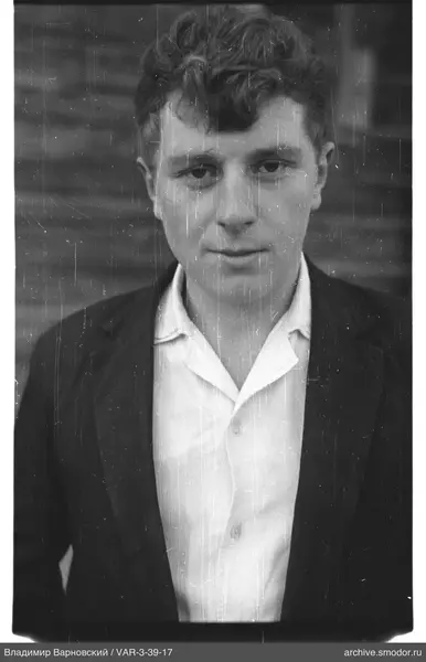 Portrait of a man in a light shirt and dark jacket