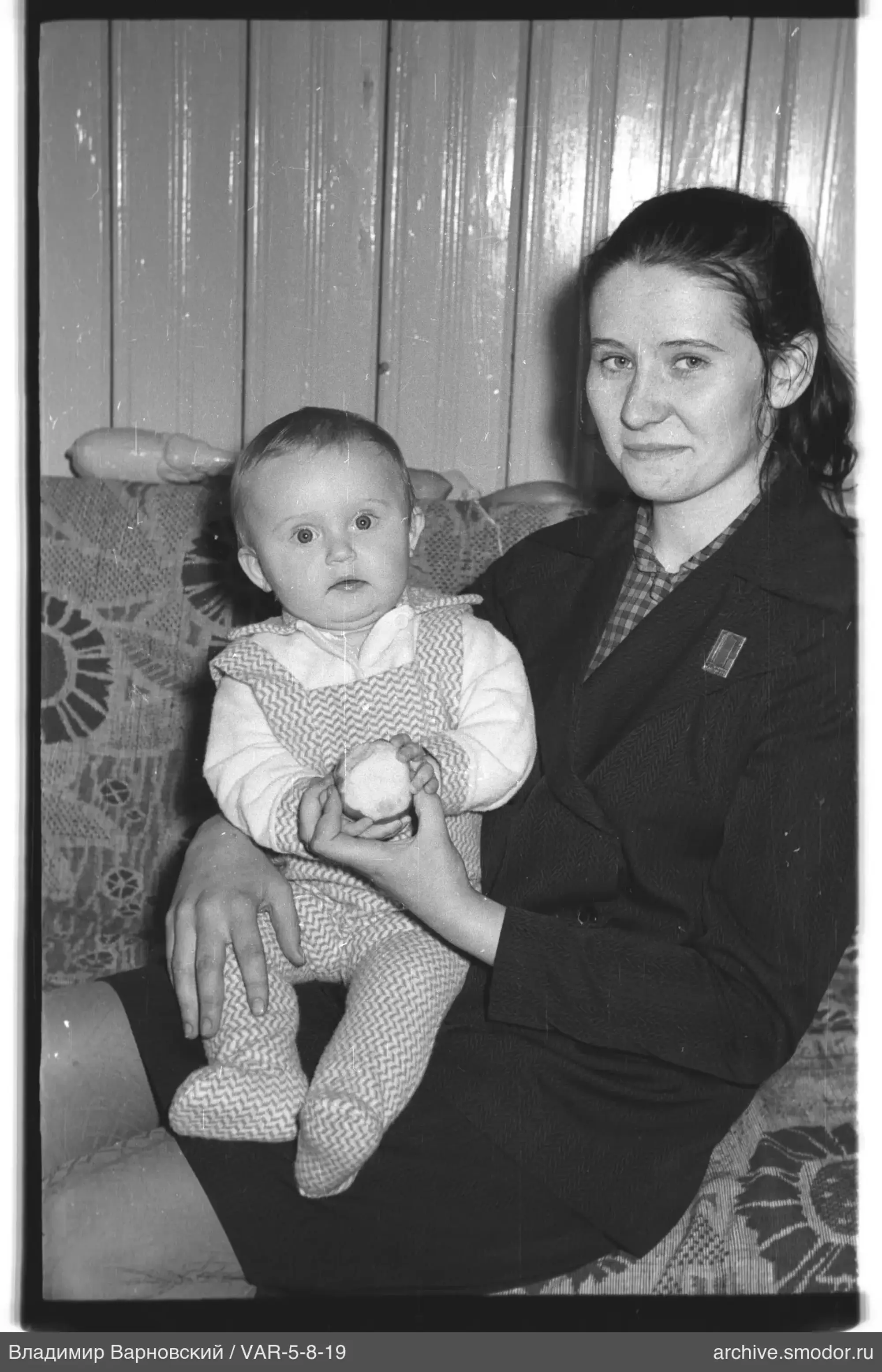 Woman with child on sofa