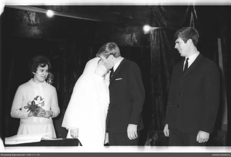 Wedding kiss with guests present