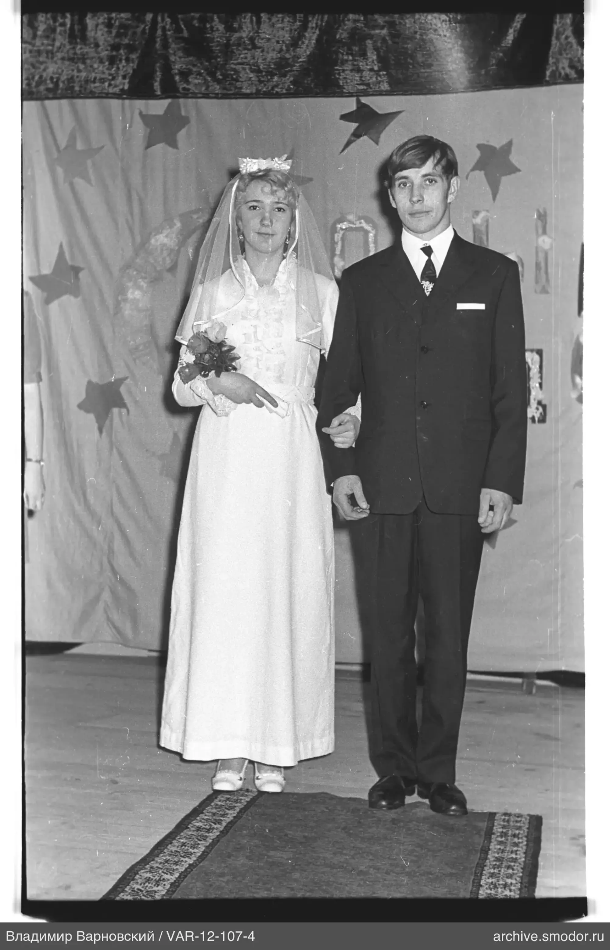Young woman with bouquet and scroll