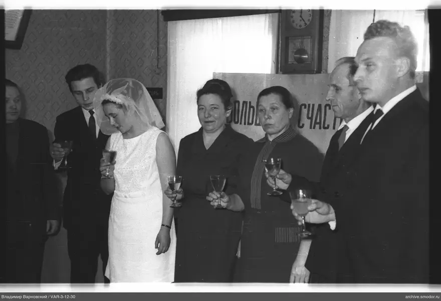 Group portrait with woman in white dress