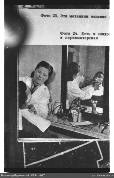 Woman in a white coat at a mirror