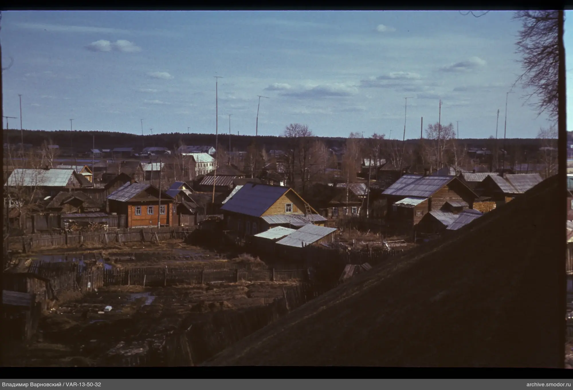 Village with wooden houses and metal roofs