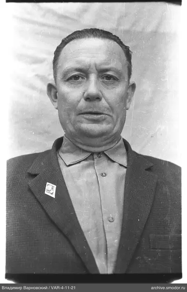 Portrait of a man with badge on jacket