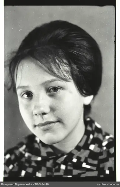 Portrait of a woman in a geometric patterned shirt