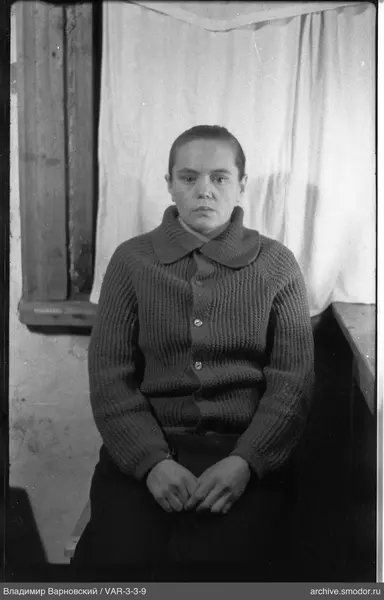 Portrait of a woman in a dark cardigan