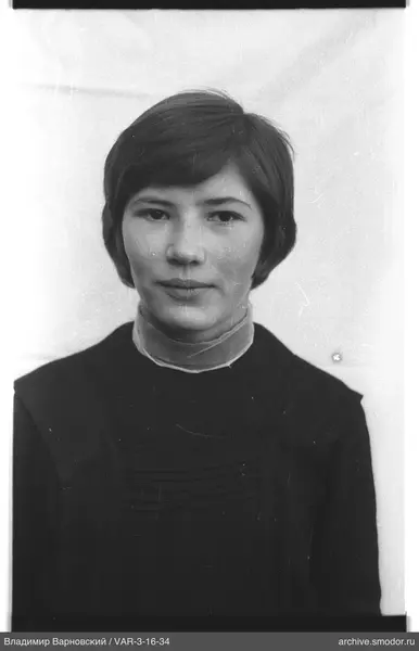 Bust portrait of a woman with short dark hair