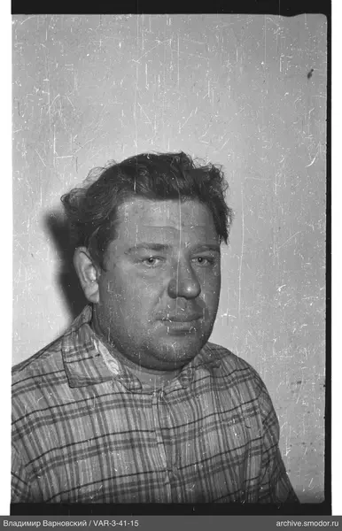 Portrait of a man in a checkered shirt