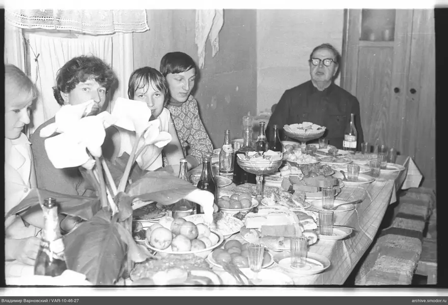 Group of people at a table with flowers