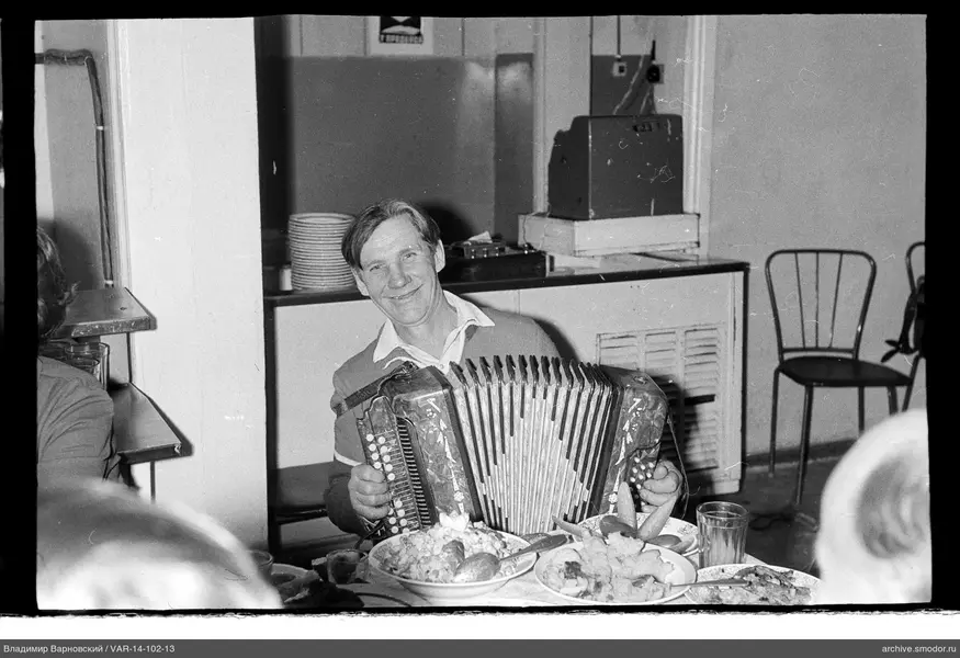 Man with accordion at the table