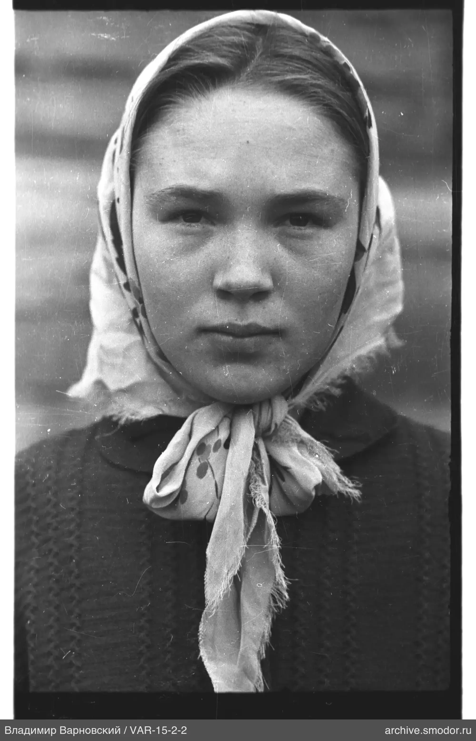 Portrait of a woman with a patterned headscarf