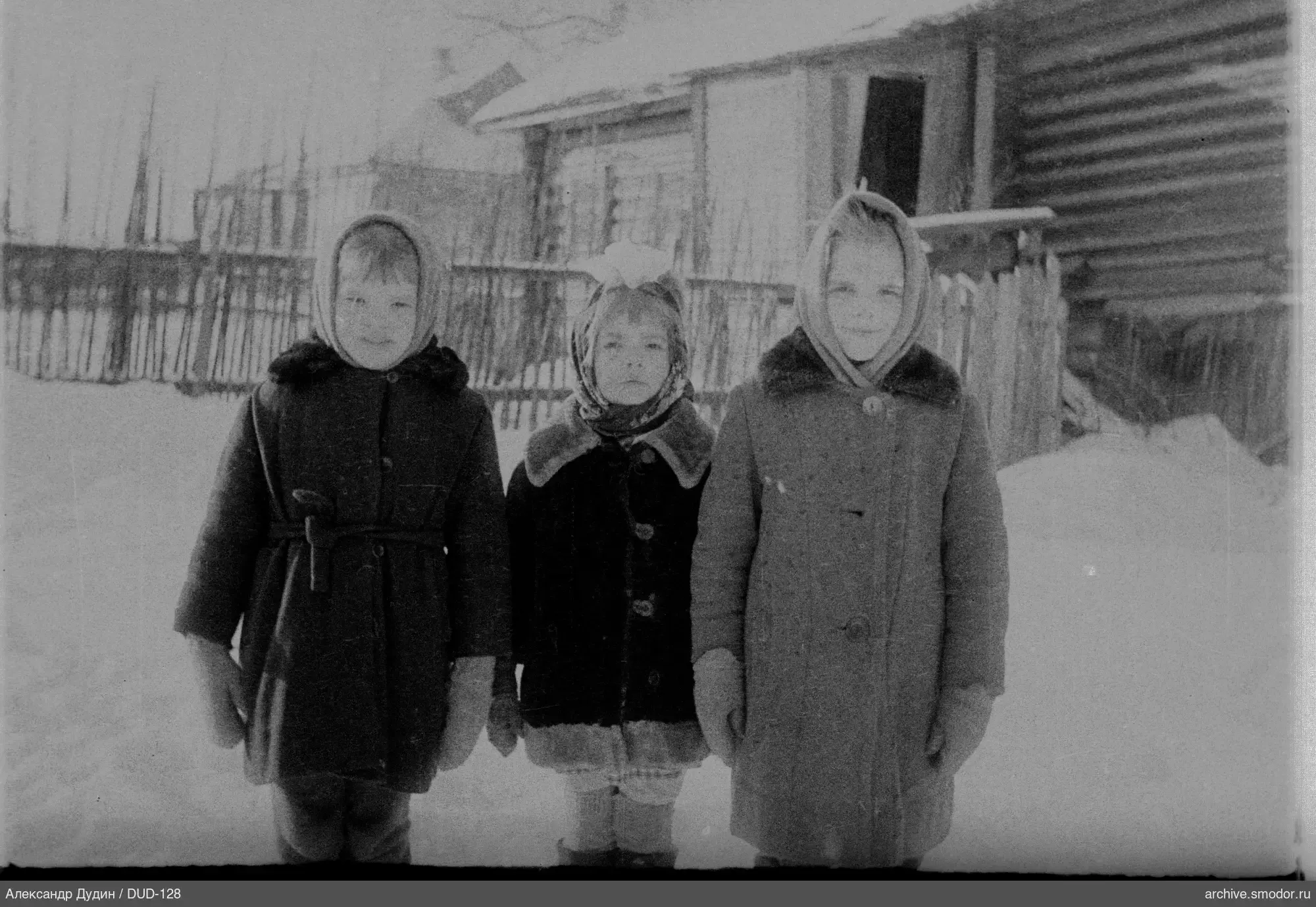 Group portrait of children in snow
