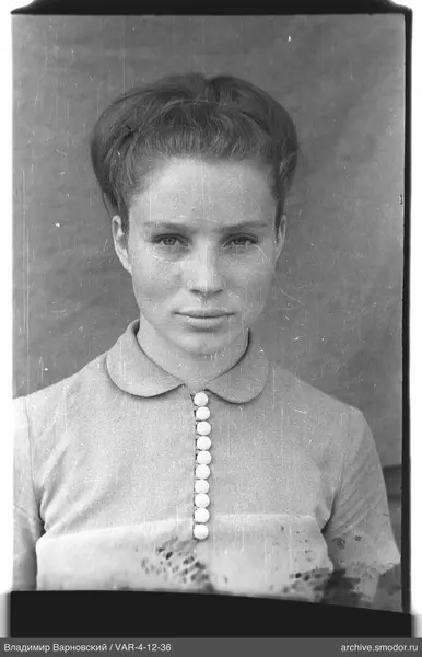 Bust portrait of a woman with bun hairstyle