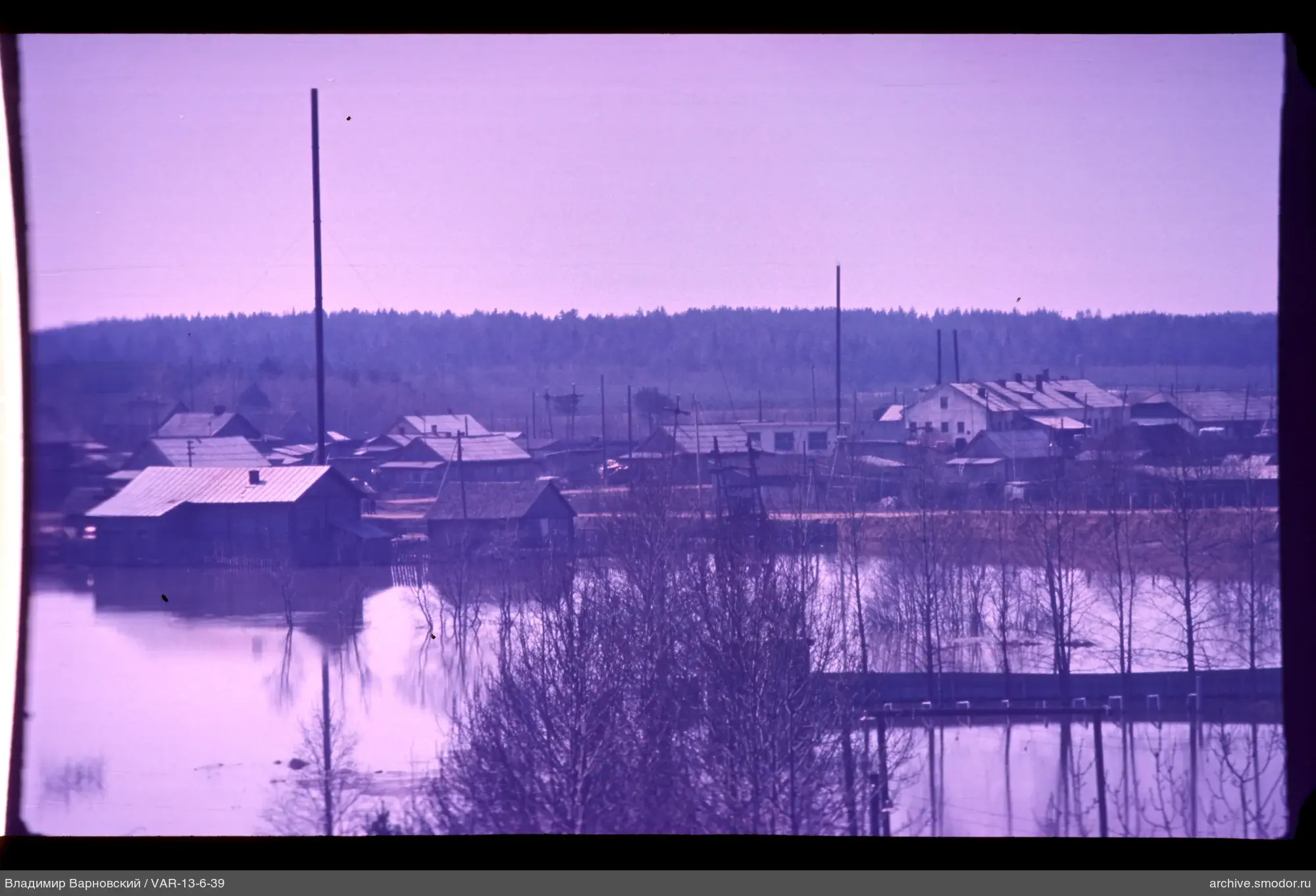 Wooden and brick houses by flooded area