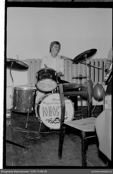 Young man at drum set with "YUNOST" inscription
