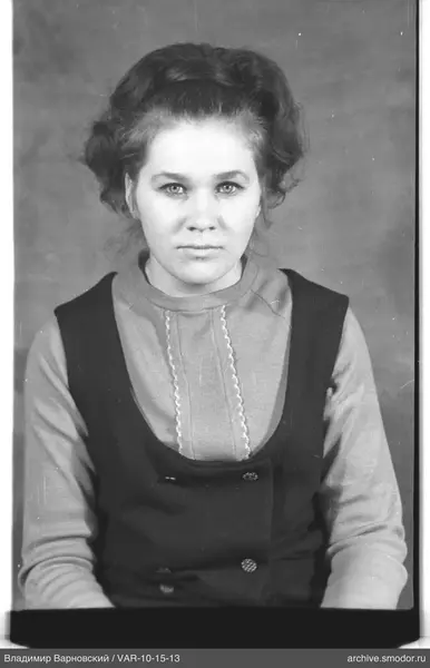 Portrait of a woman in sweater and vest