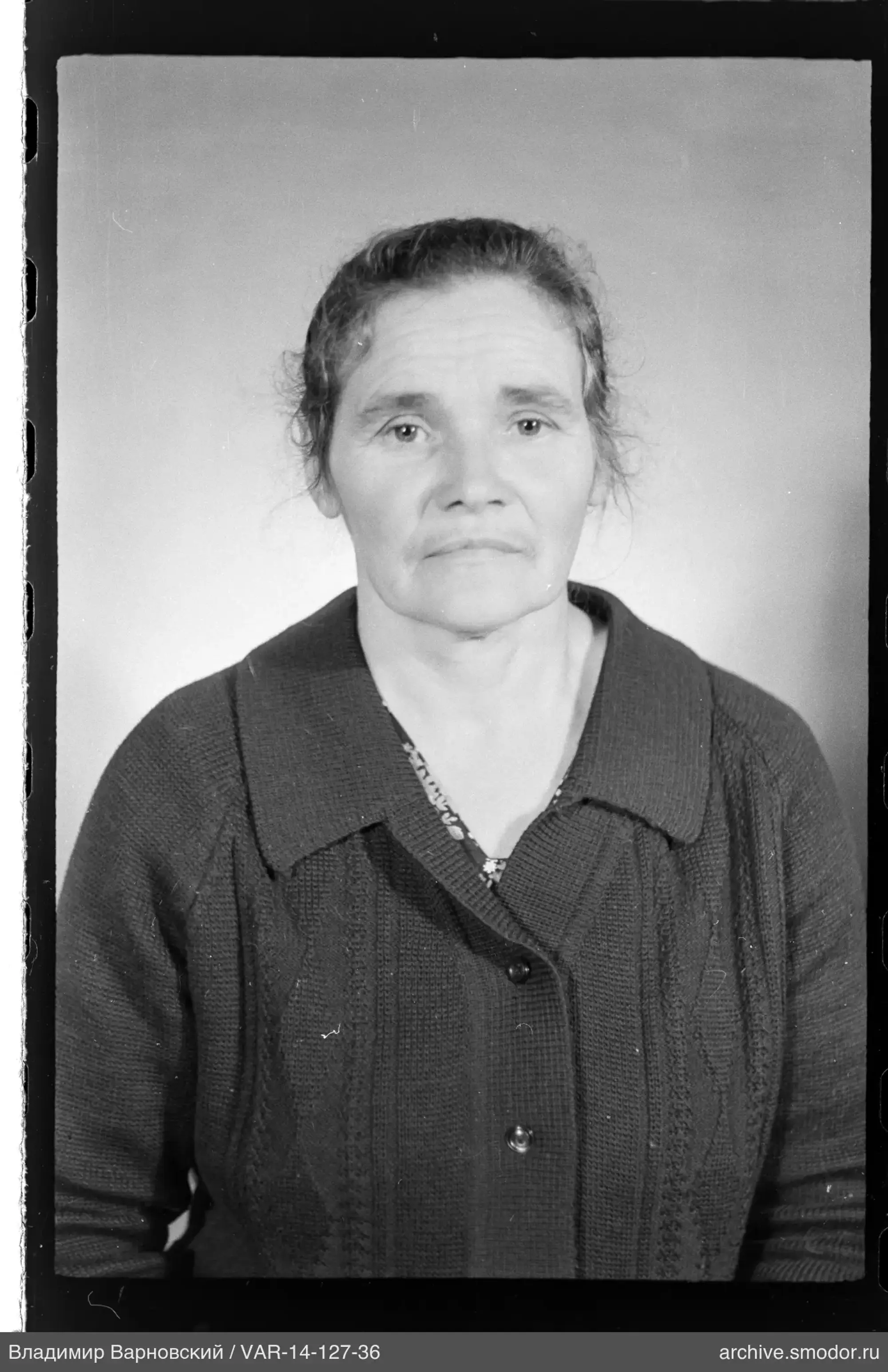Portrait of a woman in a dark cardigan