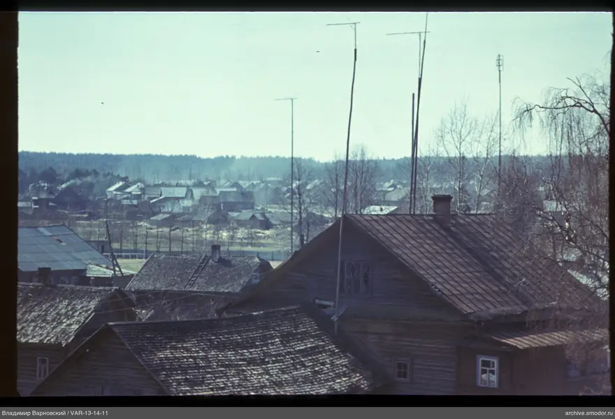 Wooden houses with roofs and antennas
