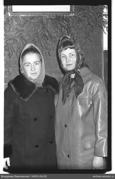 Portrait of two women in coats and headscarves