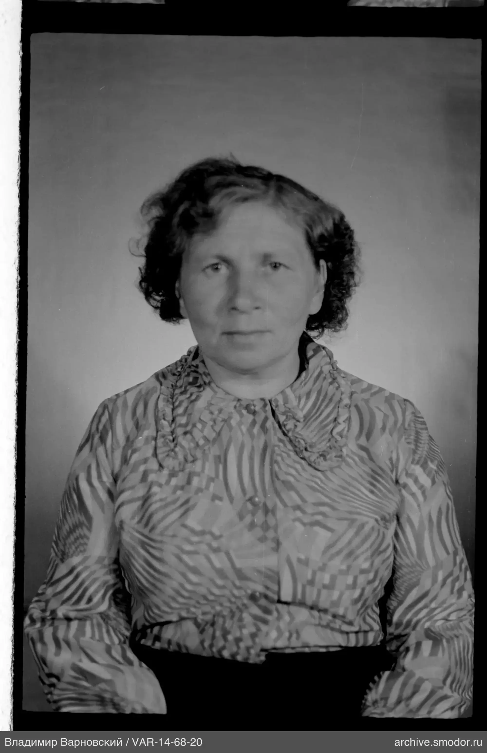 Portrait of a woman in a patterned shirt