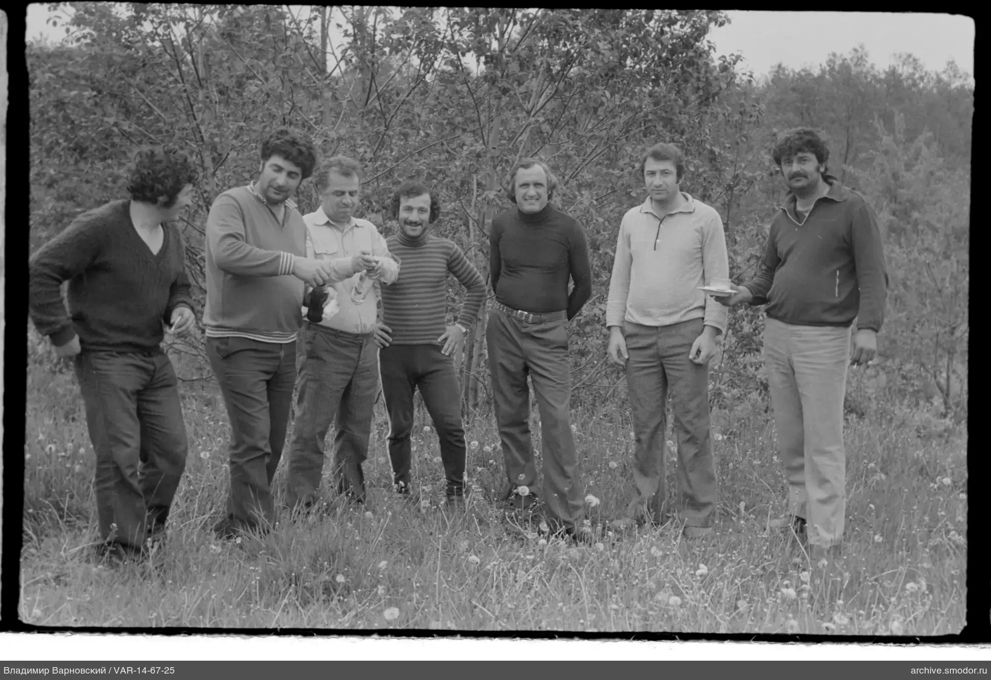 Group portrait of men on a field