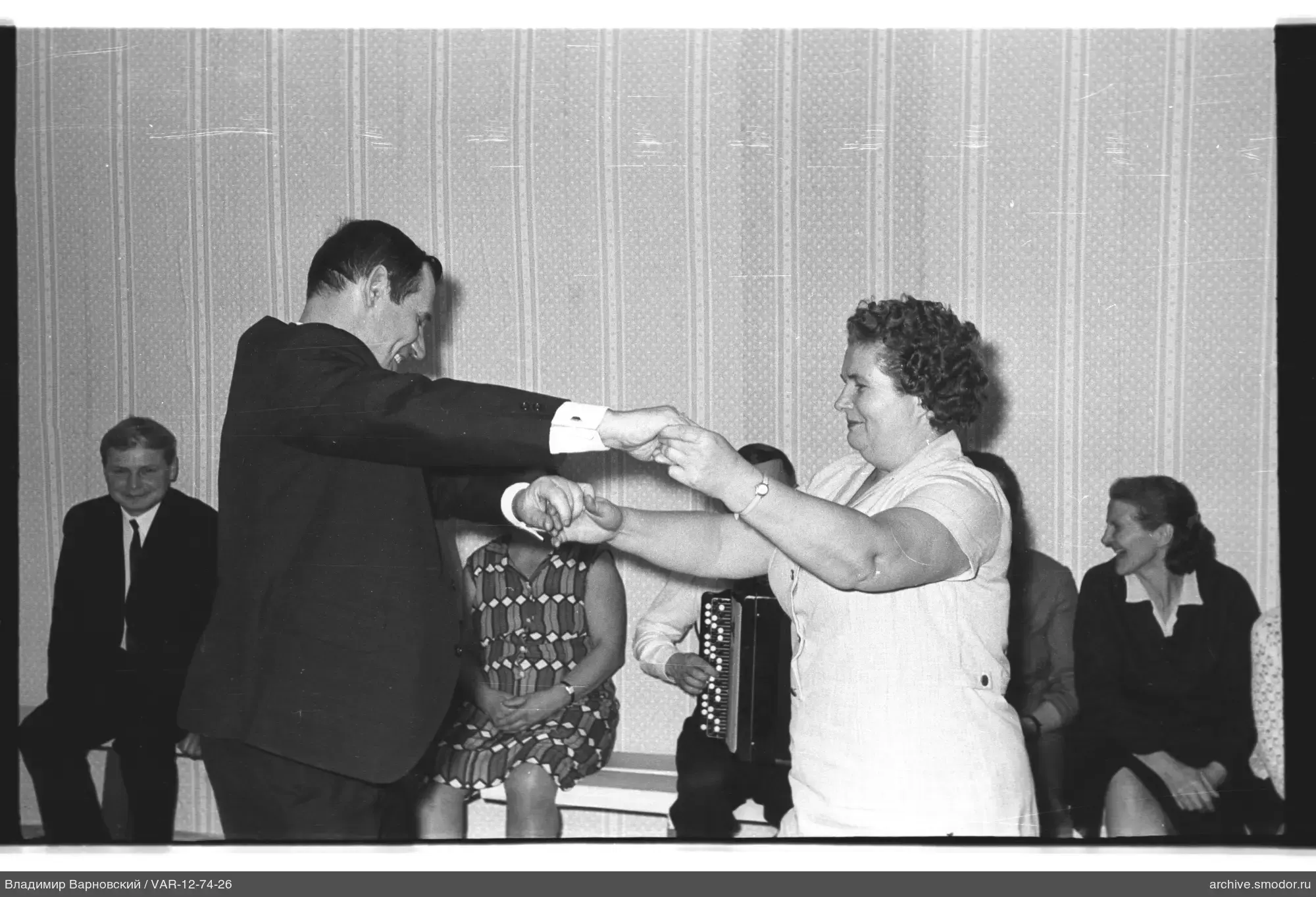 Dancing couple and background spectators