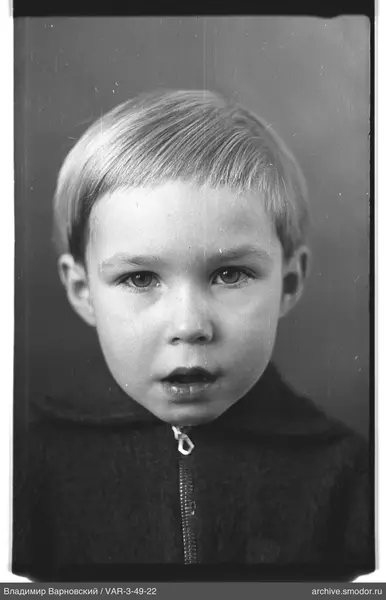 Child's portrait in dark clothing