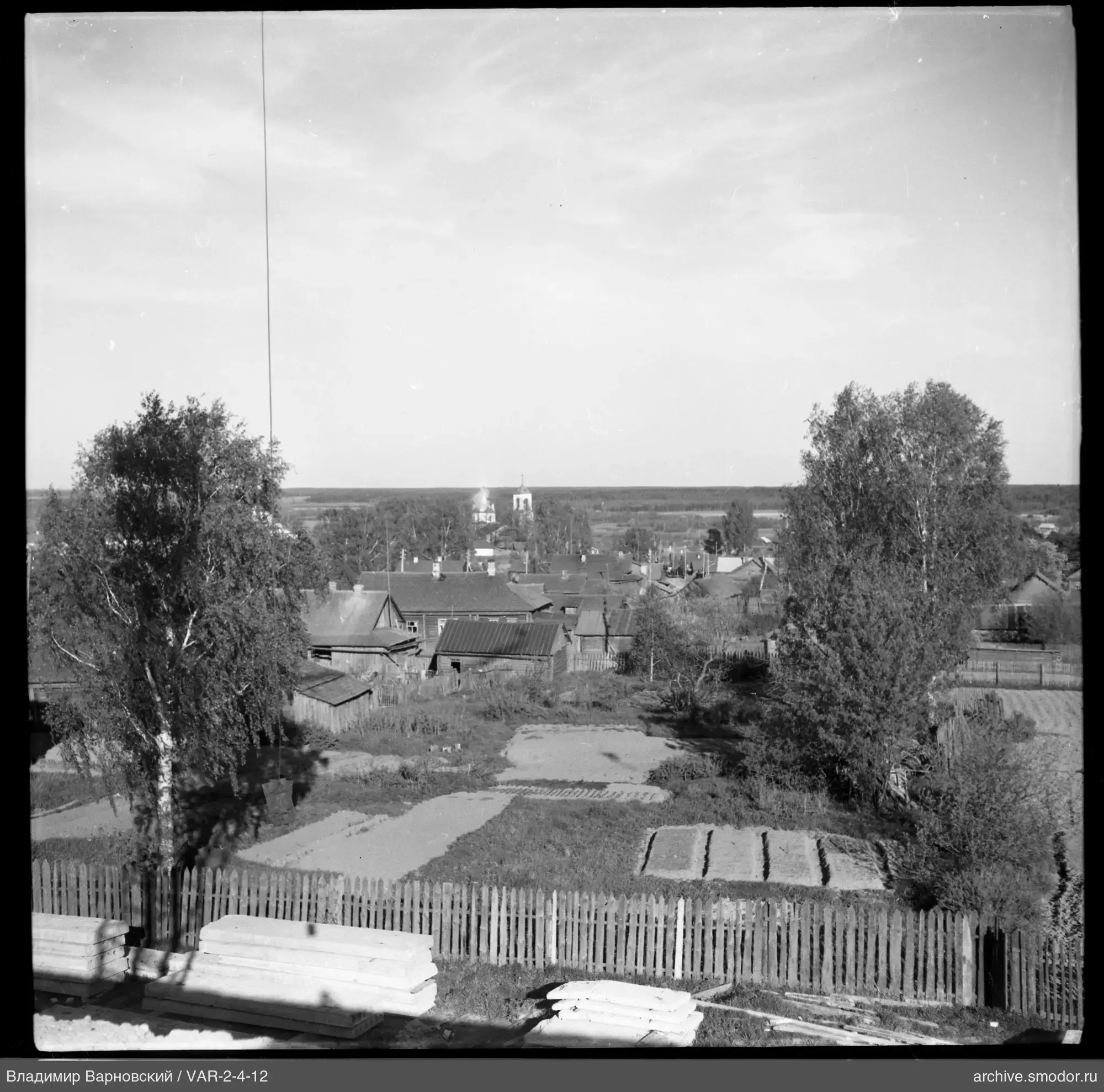 Landscape with wooden fence and church