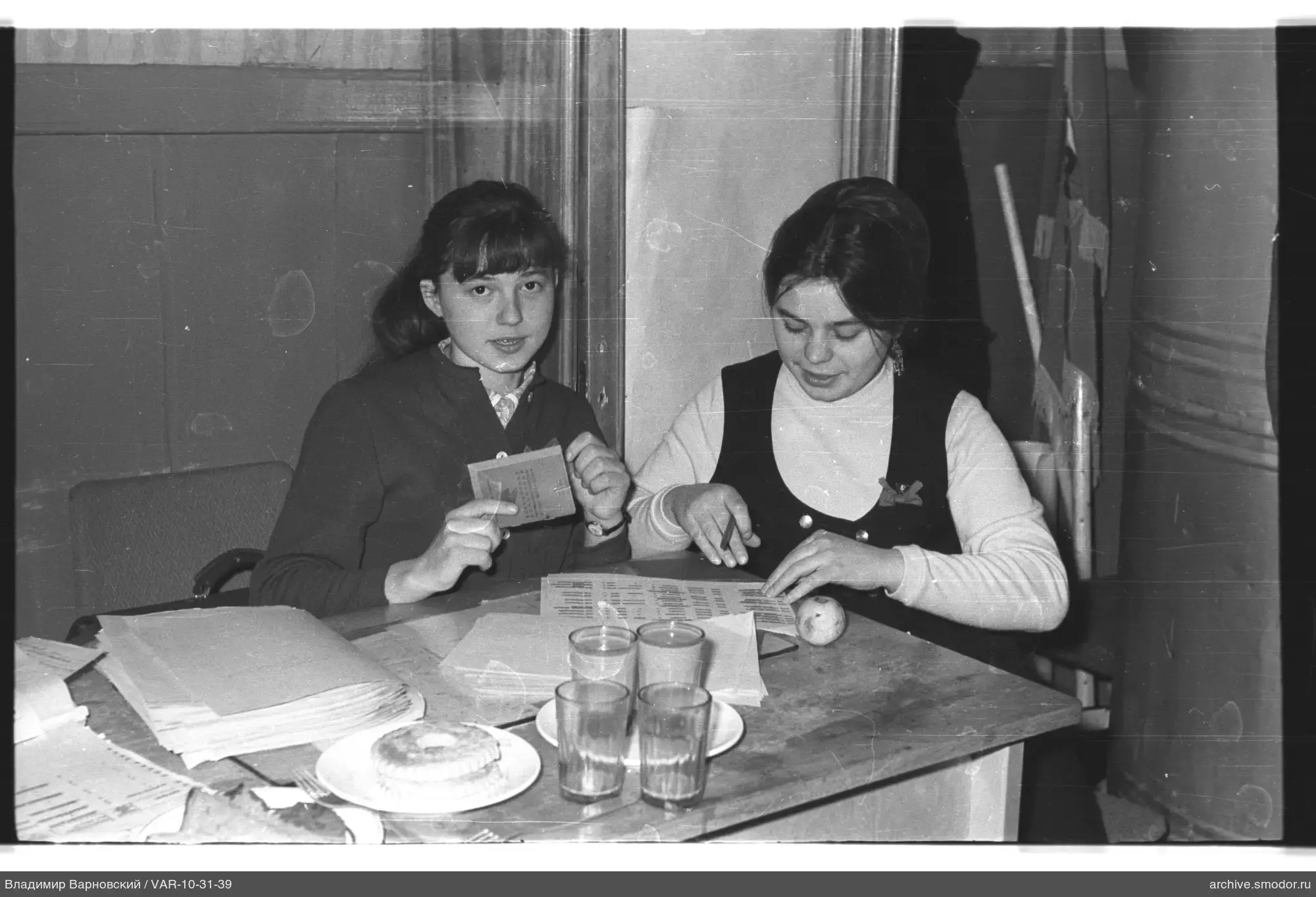 Two women at a table with papers