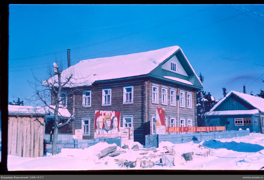 Wooden houses with snow and sky
