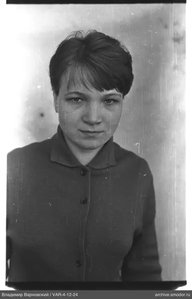 Portrait of a woman in a dark cardigan