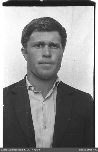 Portrait of a man in a light shirt and dark jacket