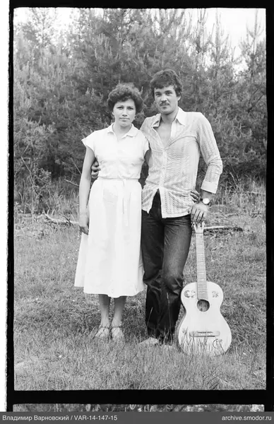 Group photo with man, woman, and guitar
