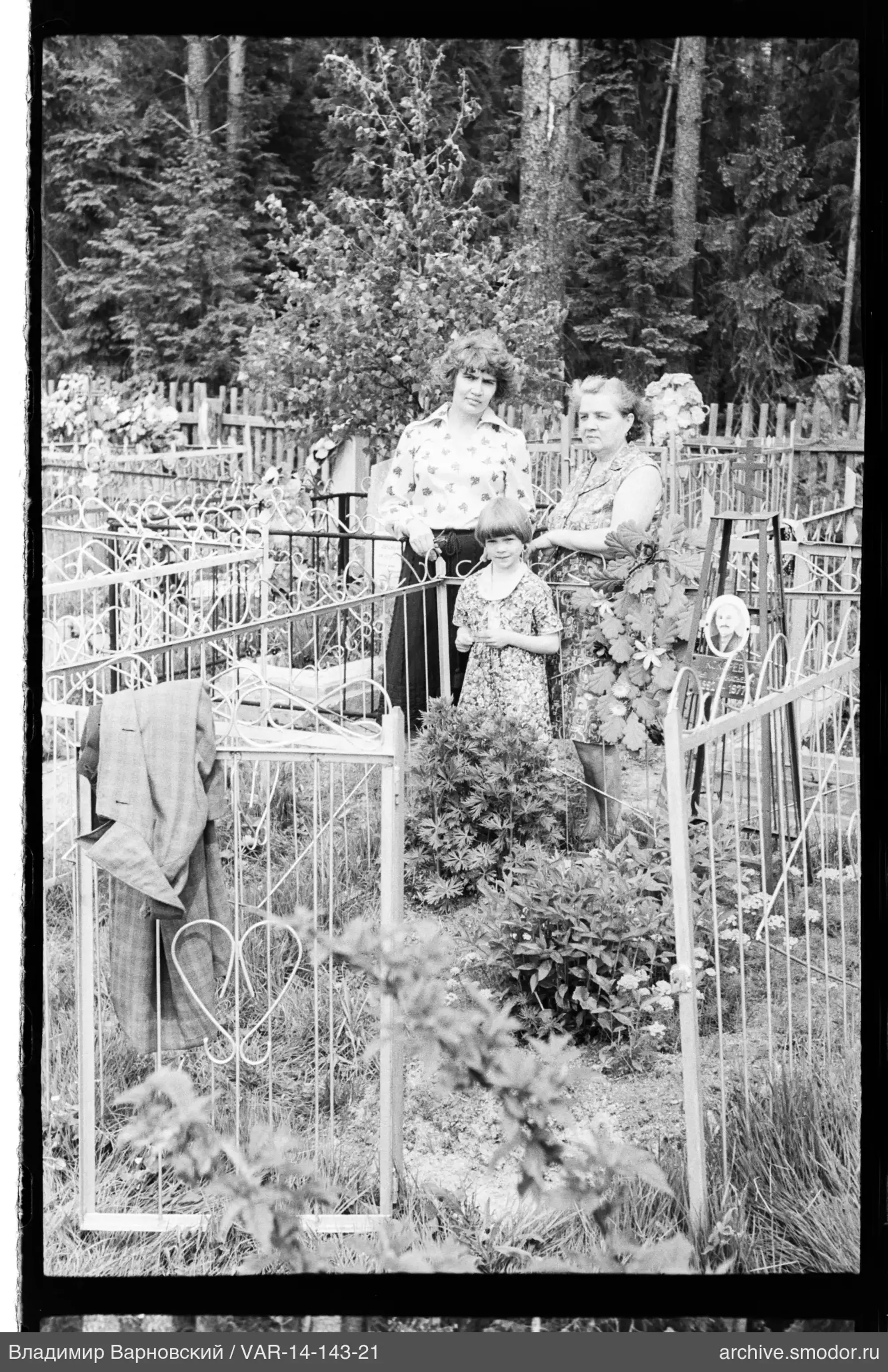 Group portrait of women near a grave monument