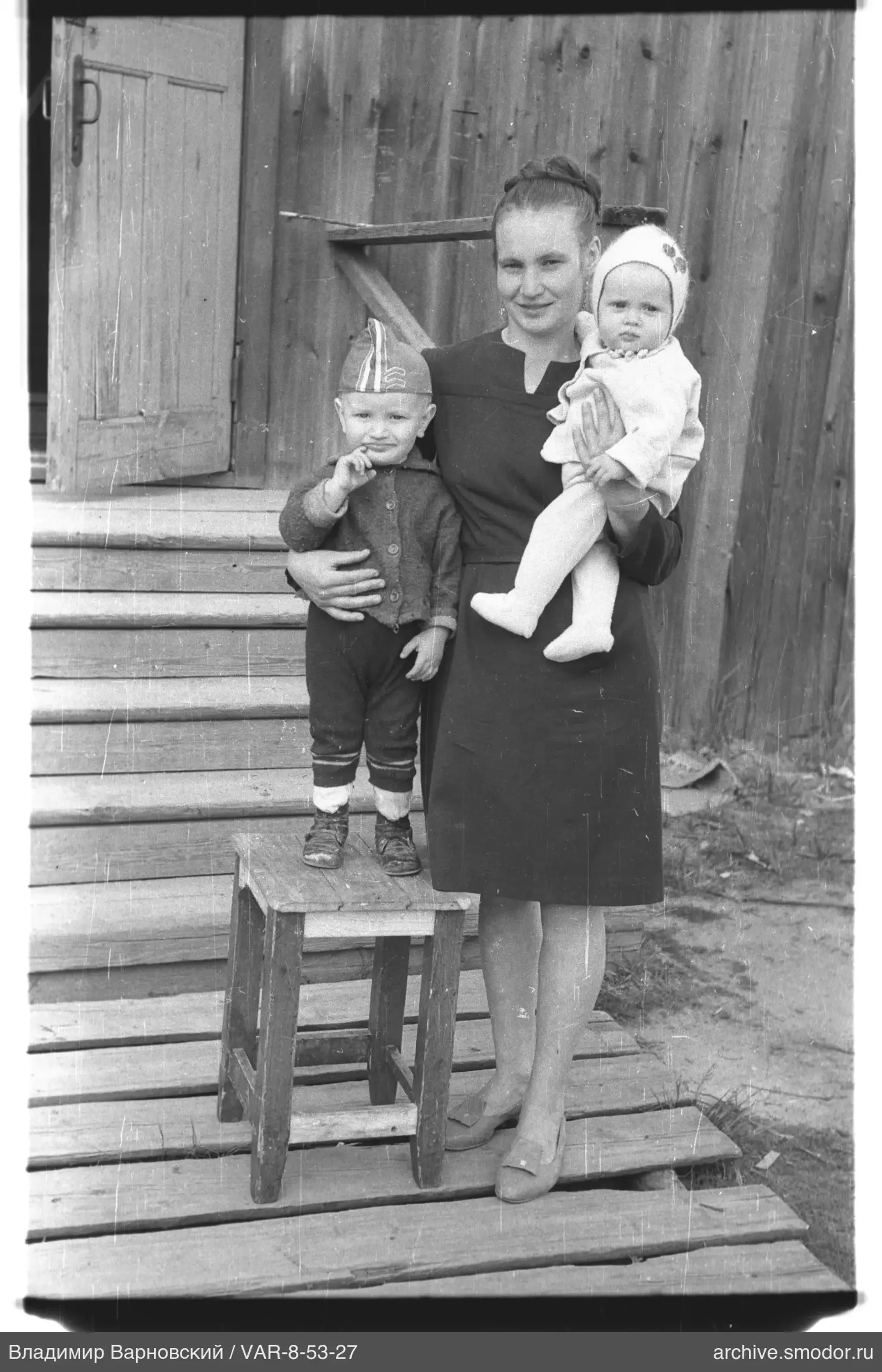 Portrait of a woman with two children