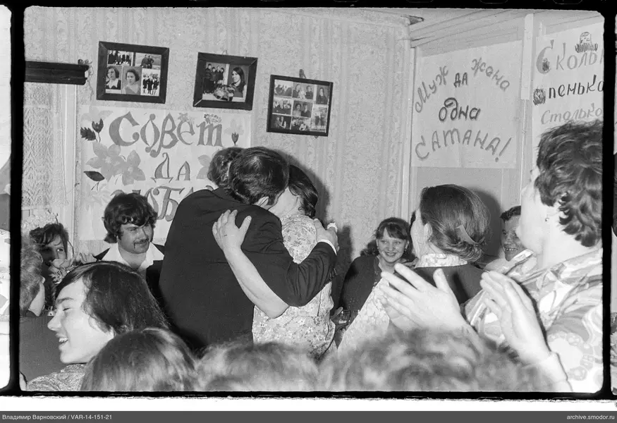 Hugging and kissing in the room's center