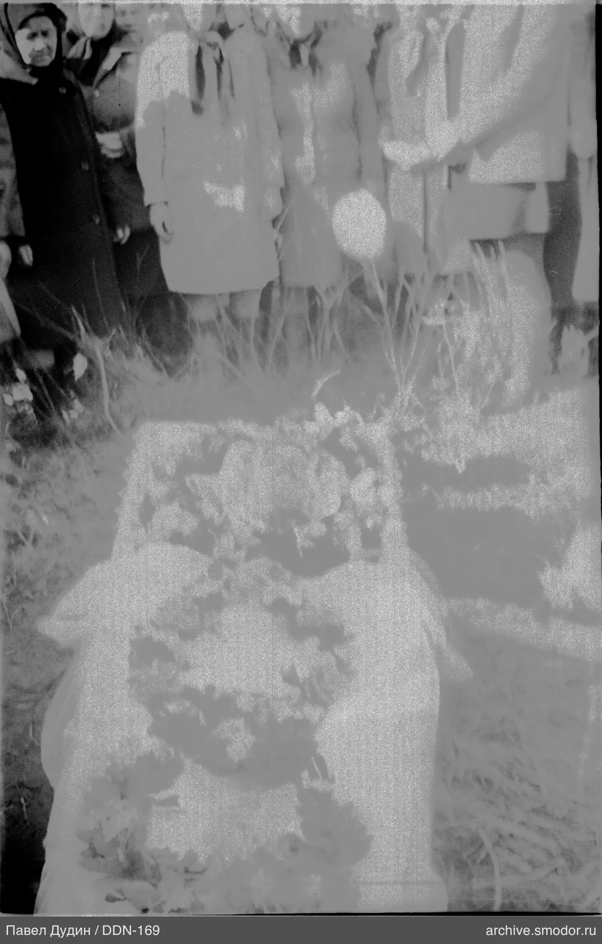 Group portrait with flowers on the ground