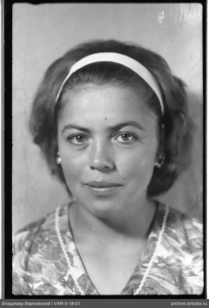 Bust portrait of a woman with headband and jewelry
