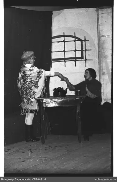 Two women holding hands at the table