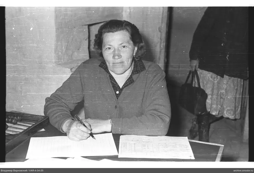 Woman writing at a table