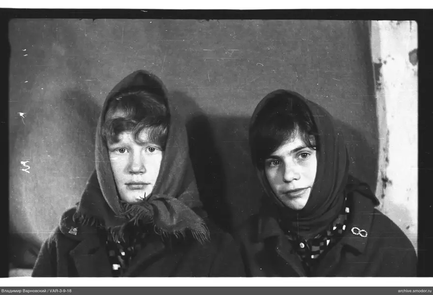 Two girls in headscarves and coats