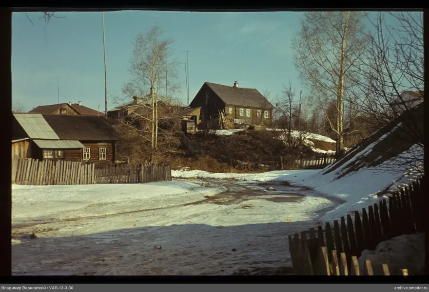 Village street with wooden fences