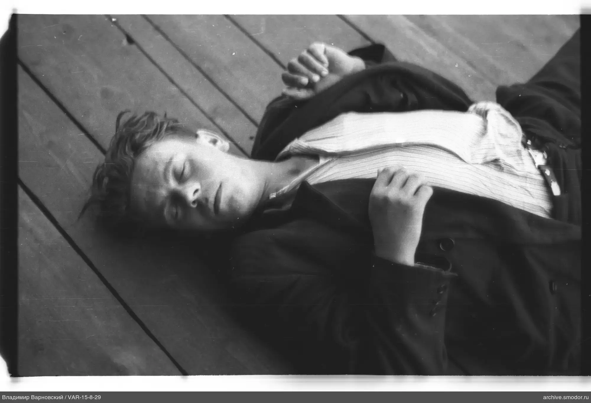 Man lying on wooden floor