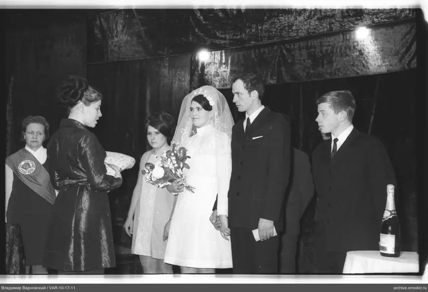 Bride and groom with guests at event