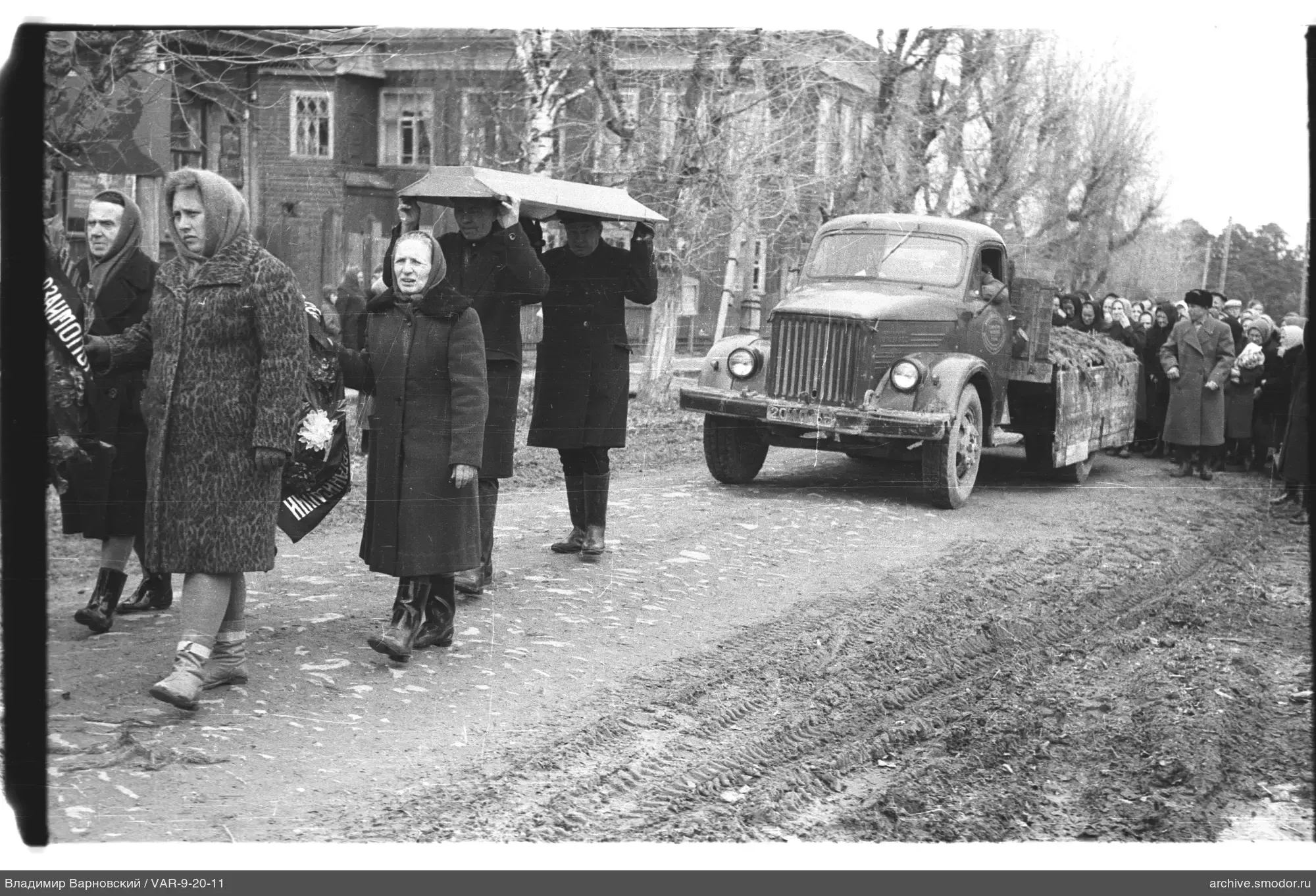 Funeral procession with coffin and mourners