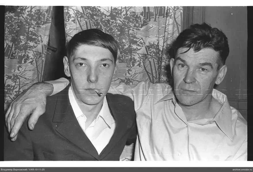 Two men in group portrait