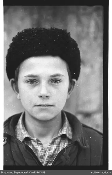 Portrait of a young man in a fur hat